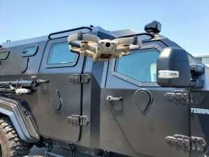 Loki-2 flying in front of a police bearcat
