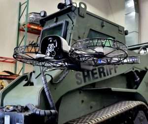 Sheriff tactical vehicle with the Vesper flying in front of it